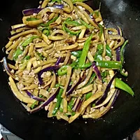 3:Get that wok hot and add the eggplant and keep things moving